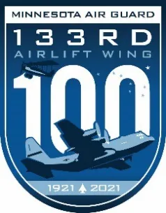 Blue shield-shaped Minnesota Air Guard 133rd Airlift Wing emblem with a large 100, a biplane, a C-130 and the years 1921 and 2021