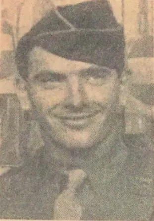 Faded wartime portrait of a smiling young Harvey J. Gleason in an Army garrison cap, uniform shirt and tie.