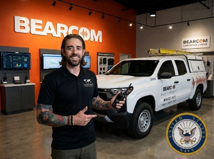Christopher Paulsen in a BearCom showroom beside a BearCom truck